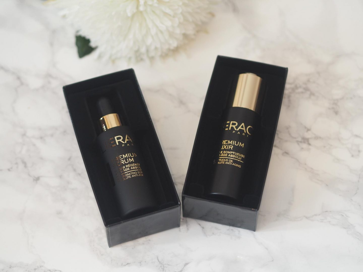 Lierac Paris flatlay with Premium Elixir and Premium Serum