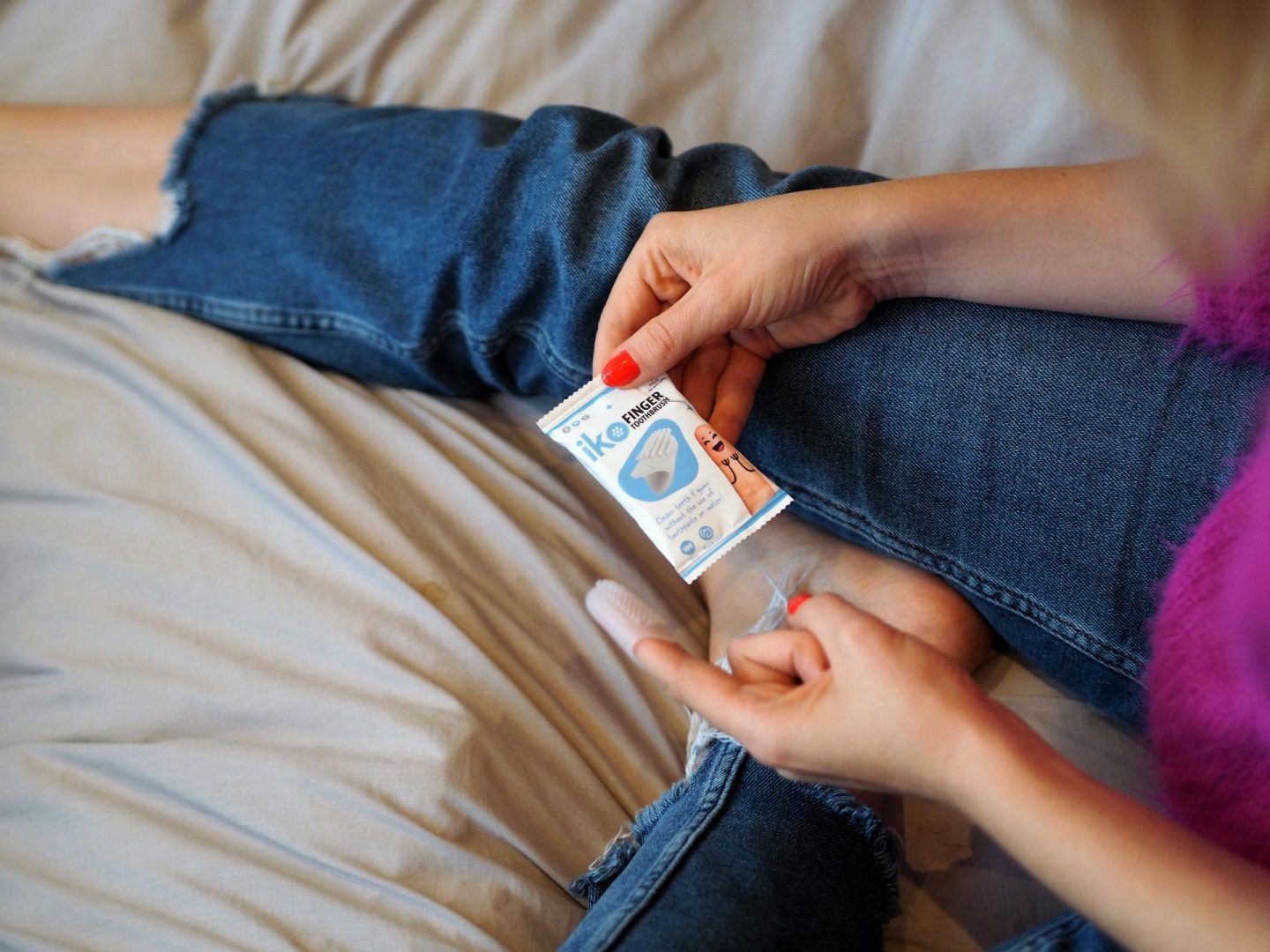 cleaning teeth on the go - iko Finger Toothbrush from Melo Labs