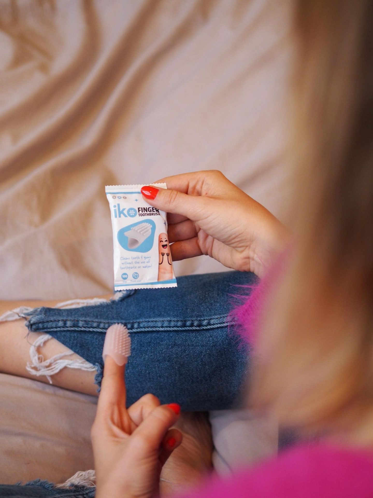 cleaning teeth on the go - iko Finger Toothbrush from Melo Labs